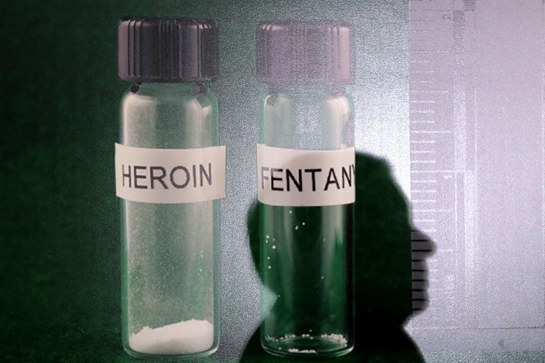 The shadow of U.S. Sen. Lindsey Graham is cast on a photograph of heroin and fentanyl